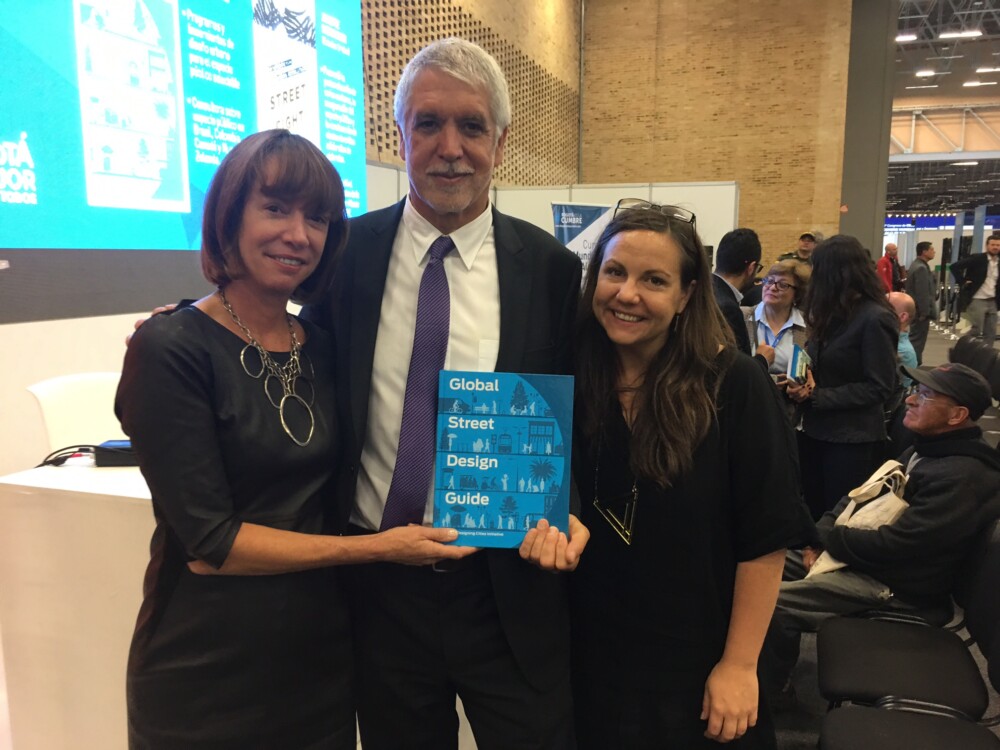 Picture of Janette Sadik-Khan, The Mayor of Bogota, and Skye Duncan holding the Global Streets Design Guide